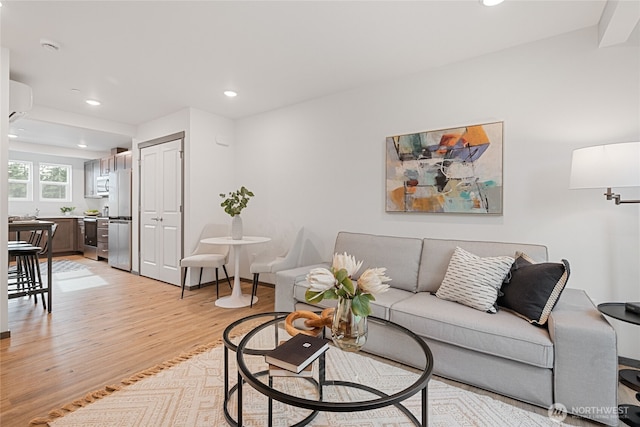 1339 Nolta Loop NE, Bainbridge Island, WA 98110 - living area featuring light wood-style floors, a wall mounted AC, and recessed lighting