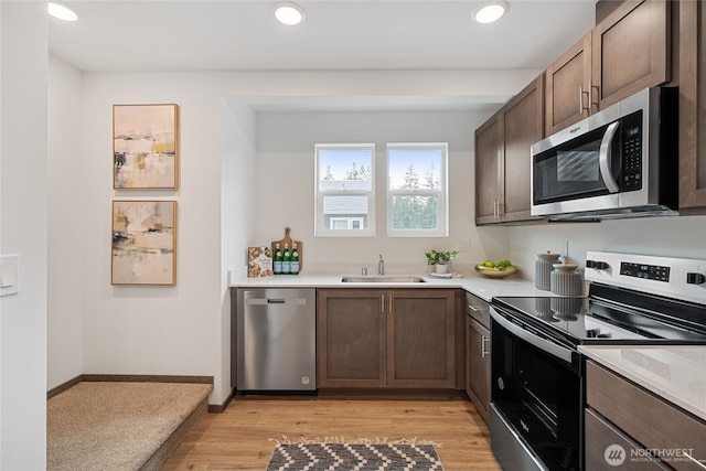 1339 Nolta Loop NE, Bainbridge Island, WA 98110 - kitchen with appliances with stainless steel finishes, light countertops, light wood-type flooring, recessed lighting, and dark brown cabinetry