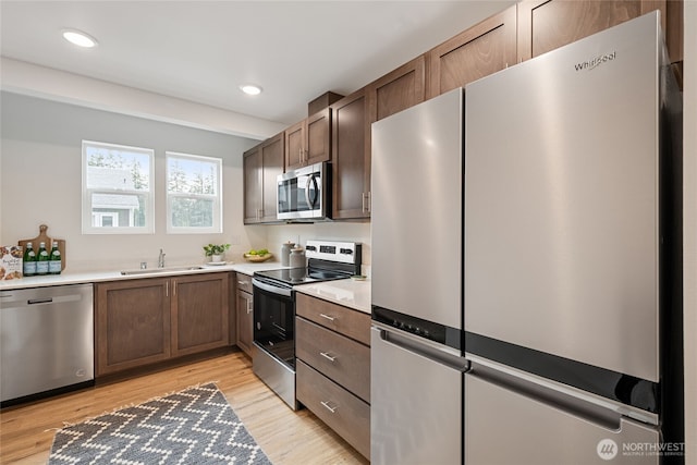1339 Nolta Loop NE, Bainbridge Island, WA 98110 - kitchen featuring stainless steel appliances, light wood-style flooring, light countertops, and recessed lighting