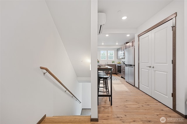 1339 Nolta Loop NE, Bainbridge Island, WA 98110 - corridor featuring an upstairs landing, light wood finished floors, and recessed lighting