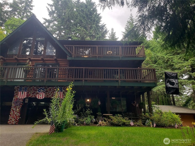70 NE Wanda Ln, Belfair, WA 98528 - back of property with a deck and log exterior