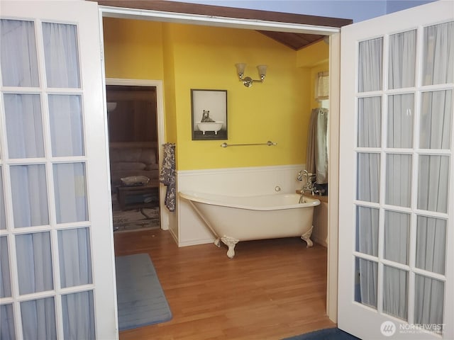 70 NE Wanda Ln, Belfair, WA 98528 - full bath with wood finished floors and a freestanding tub