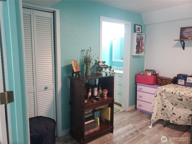 70 NE Wanda Ln, Belfair, WA 98528 - bedroom with light wood-style flooring and a closet