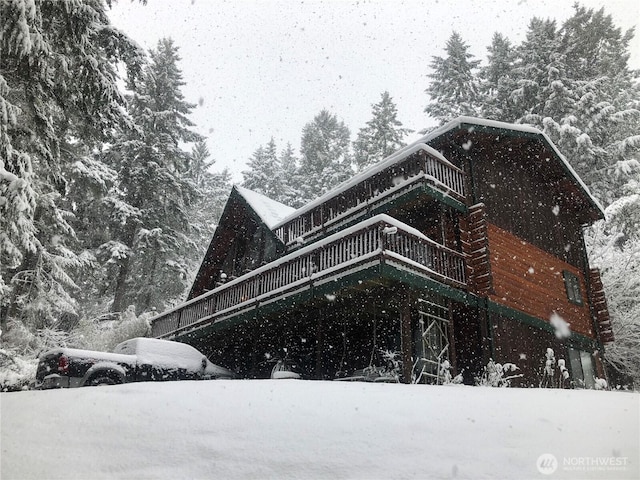 70 NE Wanda Ln, Belfair, WA 98528 - view of snowy exterior with a wooden deck