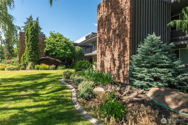 201 Pennsylvania Ave Unit 15, Wenatchee, WA 98801 - view of side of home featuring a yard, brick siding, and board and batten siding