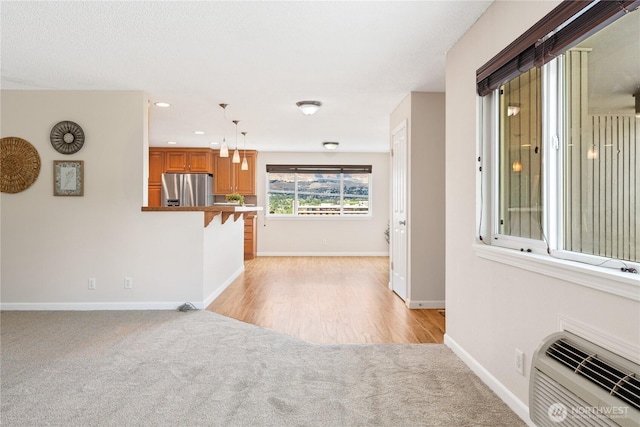 201 Pennsylvania Ave Unit 15, Wenatchee, WA 98801 - unfurnished living room featuring light colored carpet, recessed lighting, and a wall mounted AC