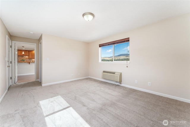 201 Pennsylvania Ave Unit 15, Wenatchee, WA 98801 - spare room featuring a wall unit AC and carpet flooring