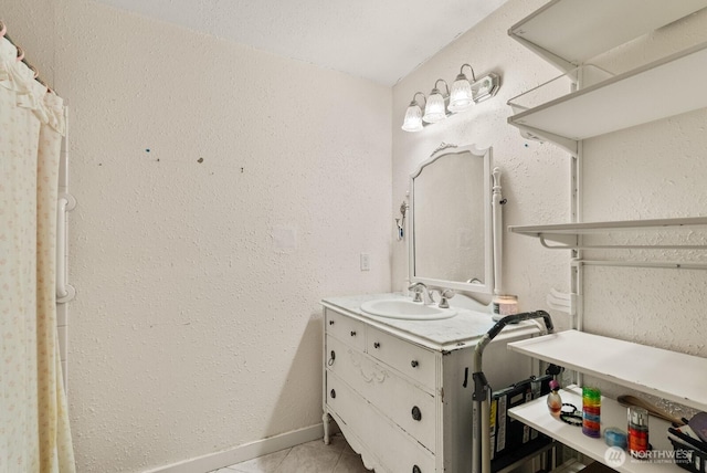 11315 85th Ave E, Puyallup, WA 98373 - bathroom featuring vanity, tile patterned floors, and a textured wall