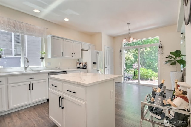 35055 41st Pl S, Auburn, WA 98001 - kitchen featuring white fridge with ice dispenser, dark wood-style floors, recessed lighting, a chandelier, and pendant lighting