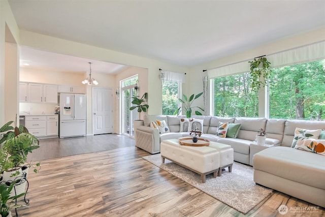 35055 41st Pl S, Auburn, WA 98001 - living room with light wood finished floors and a chandelier