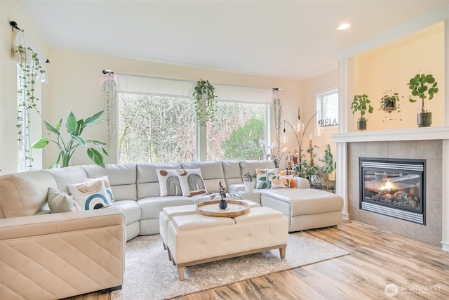 35055 41st Pl S, Auburn, WA 98001 - living area featuring wood finished floors, a tiled fireplace, and recessed lighting