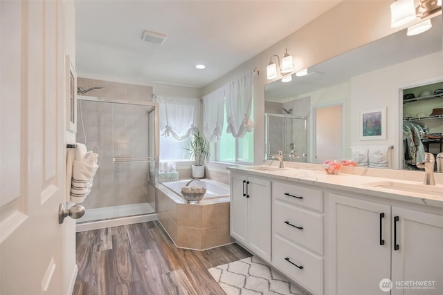 35055 41st Pl S, Auburn, WA 98001 - full bath featuring a stall shower, a garden tub, double vanity, wood finished floors, and a spacious closet