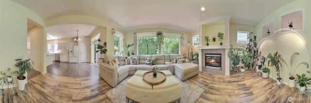 35055 41st Pl S, Auburn, WA 98001 - living room with wood finished floors, a glass covered fireplace, arched walkways, and lofted ceiling