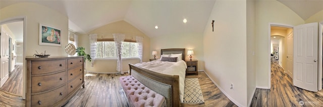 35055 41st Pl S, Auburn, WA 98001 - bedroom featuring arched walkways, lofted ceiling, and wood finished floors