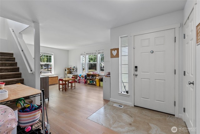 6974 Prism St SE, Lacey, WA 98513 - foyer with light wood-type flooring and stairs