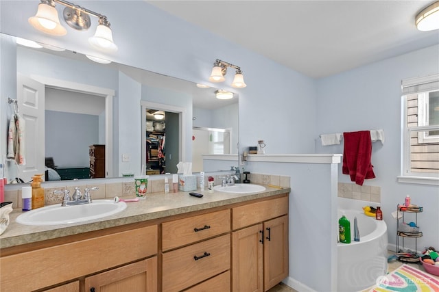 6974 Prism St SE, Lacey, WA 98513 - ensuite bathroom featuring double vanity, a garden tub, and a shower stall