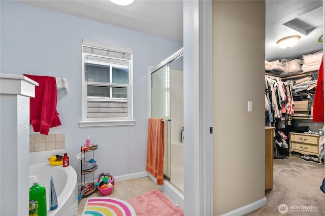 6974 Prism St SE, Lacey, WA 98513 - full bath with a stall shower, a spacious closet, and a bath