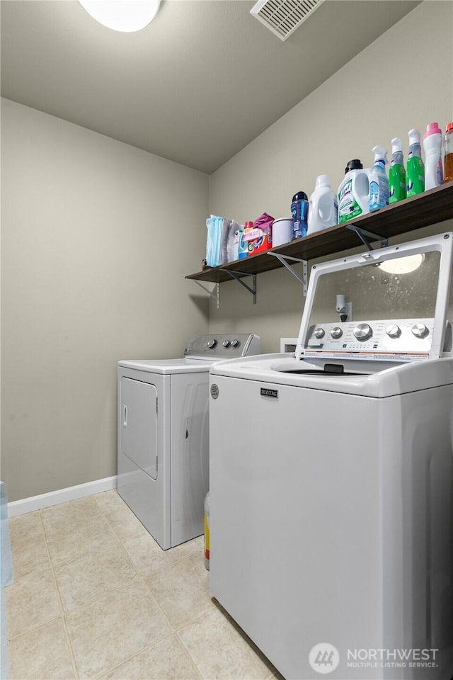 6974 Prism St SE, Lacey, WA 98513 - laundry area with independent washer and dryer and light tile patterned flooring