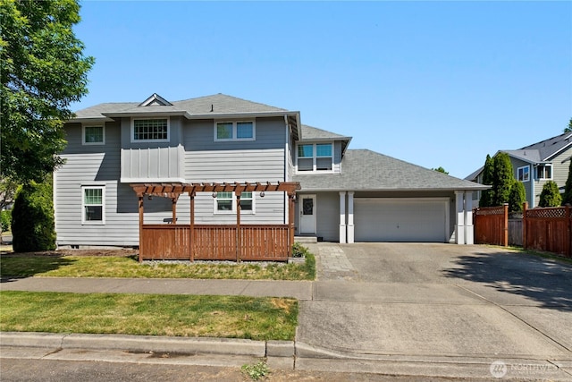 6974 Prism St SE, Lacey, WA 98513 - view of front of house with driveway, a garage, a pergola, and roof with shingles