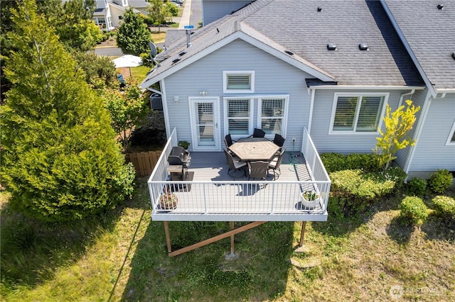 7103 Hazel Pl SE, Auburn, WA 98092 - rear view of property featuring a shingled roof, a wooden deck, and outdoor dining area