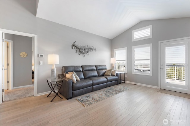 7103 Hazel Pl SE, Auburn, WA 98092 - living area featuring vaulted ceiling and light wood-style flooring