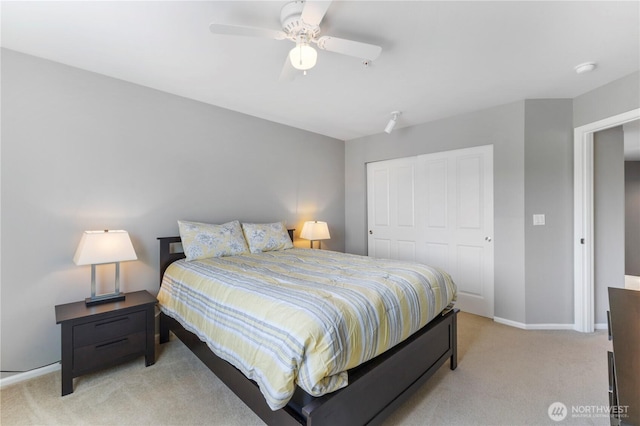 7103 Hazel Pl SE, Auburn, WA 98092 - bedroom with light colored carpet, a closet, and a ceiling fan