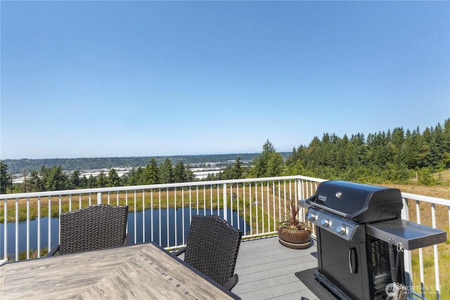 7103 Hazel Pl SE, Auburn, WA 98092 - wooden terrace with area for grilling and a water view