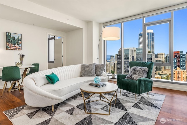 800 Columbia St Unit 2309, Seattle, WA 98104 - living area featuring plenty of natural light, a view of city, and wood finished floors