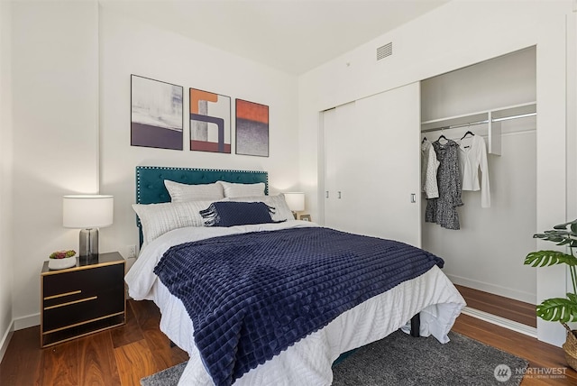 800 Columbia St Unit 2309, Seattle, WA 98104 - bedroom featuring a closet and wood finished floors