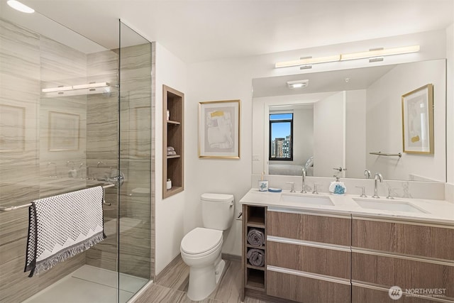 800 Columbia St Unit 2309, Seattle, WA 98104 - bathroom featuring double vanity and a shower stall