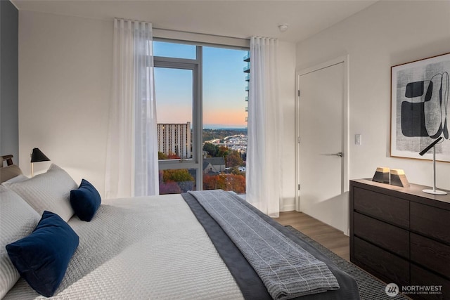 800 Columbia St Unit 2503, Seattle, WA 98104 - bedroom featuring wood finished floors