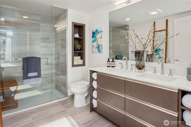 800 Columbia St Unit 2503, Seattle, WA 98104 - bathroom featuring double vanity and a stall shower