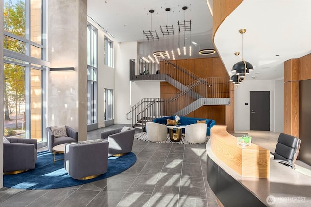 800 Columbia St Unit 2503, Seattle, WA 98104 - building lobby featuring a towering ceiling and stairway