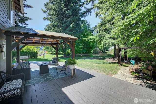 12118 261st Ave E, Buckley, WA 98321 - deck featuring a fenced backyard, a gazebo, and an outdoor living space with a fire pit