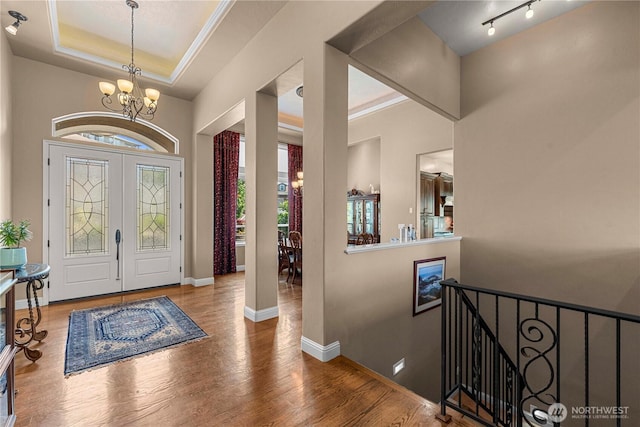 1075 Ridge Crest Dr, Wenatchee, WA 98801 - entryway with a chandelier, wood finished floors, and a raised ceiling