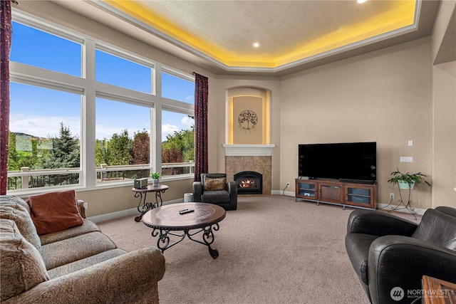 1075 Ridge Crest Dr, Wenatchee, WA 98801 - carpeted living room featuring a raised ceiling, a tiled fireplace, and recessed lighting