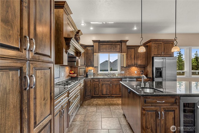 1075 Ridge Crest Dr, Wenatchee, WA 98801 - kitchen featuring stainless steel appliances, beverage cooler, stone tile floors, decorative backsplash, and pendant lighting