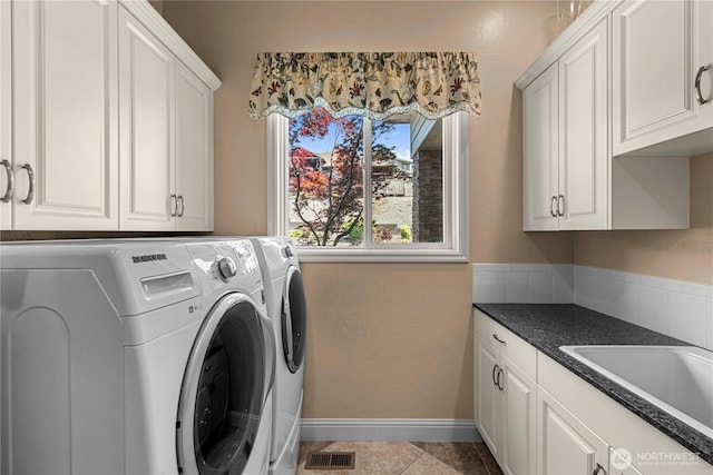 1075 Ridge Crest Dr, Wenatchee, WA 98801 - laundry area with independent washer and dryer, cabinet space, and light tile patterned floors