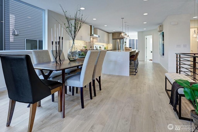 8707 116th Ave NE Unit A, Kirkland, WA 98033 - dining space with light wood-style flooring, recessed lighting, and a chandelier