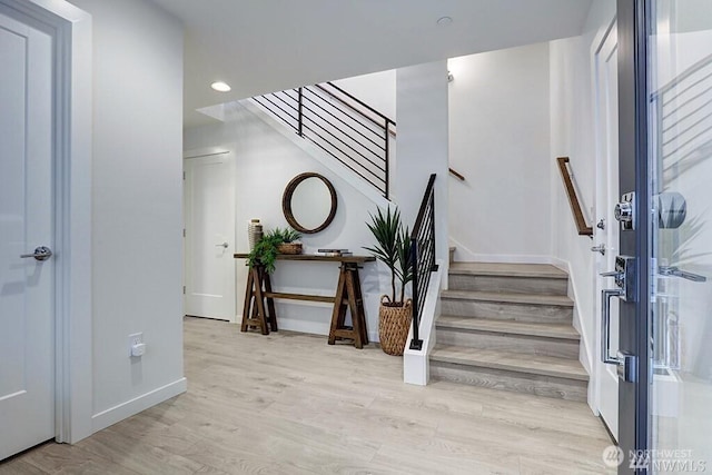8707 116th Ave NE Unit A, Kirkland, WA 98033 - staircase with wood finished floors and recessed lighting