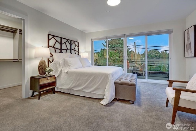 8707 116th Ave NE Unit A, Kirkland, WA 98033 - carpeted bedroom featuring access to outside and baseboards