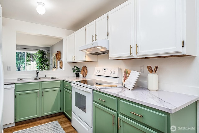 21305 50th Ave W Unit B2, Mountlake Terrace, WA 98043 - kitchen with white appliances, under cabinet range hood, white cabinets, light wood finished floors, and green cabinets