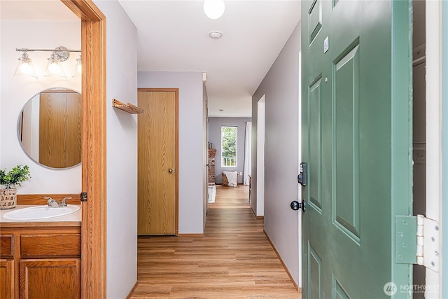 21305 50th Ave W Unit B2, Mountlake Terrace, WA 98043 - hall with a sink and light wood-type flooring
