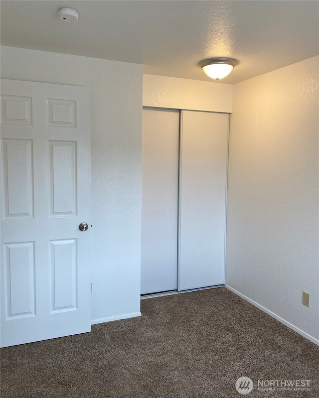 6003 Broadway, Everett, WA 98203 - unfurnished bedroom featuring carpet flooring and a closet