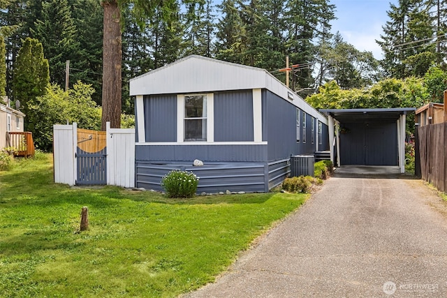 1921 208th St E Unit 7, Spanaway, WA 98387 - manufactured / mobile home with asphalt driveway and a gate