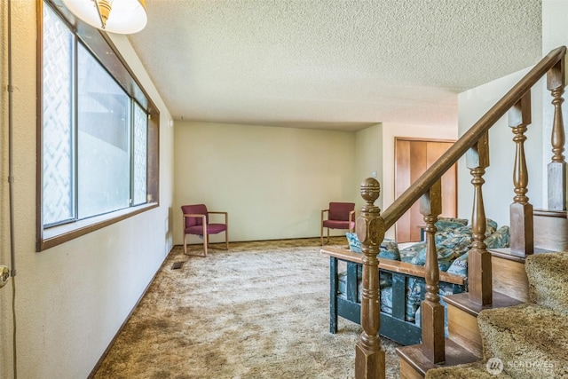 238 NE Damson Pl, College Place, WA 99324 - corridor with a textured ceiling, carpet, and stairway