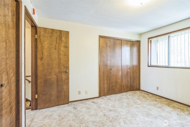 238 NE Damson Pl, College Place, WA 99324 - unfurnished bedroom featuring carpet flooring and a closet