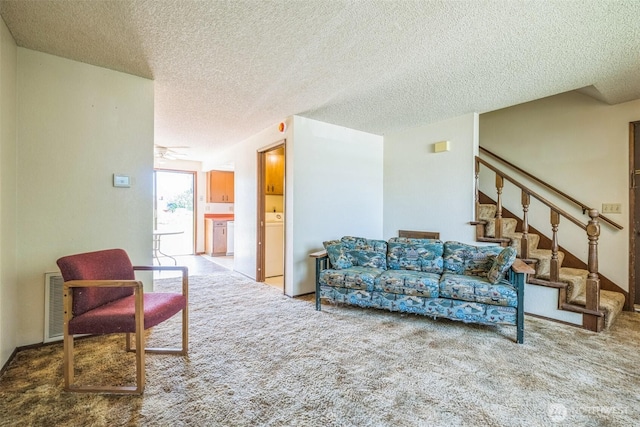 238 NE Damson Pl, College Place, WA 99324 - living room with a textured ceiling, carpet, stairs, and a ceiling fan