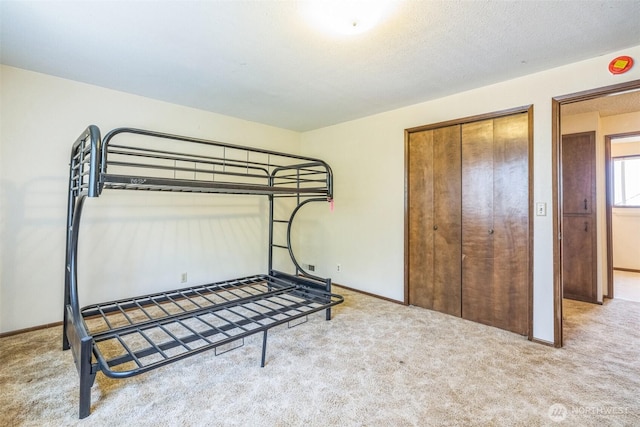 238 NE Damson Pl, College Place, WA 99324 - unfurnished bedroom featuring carpet and a closet