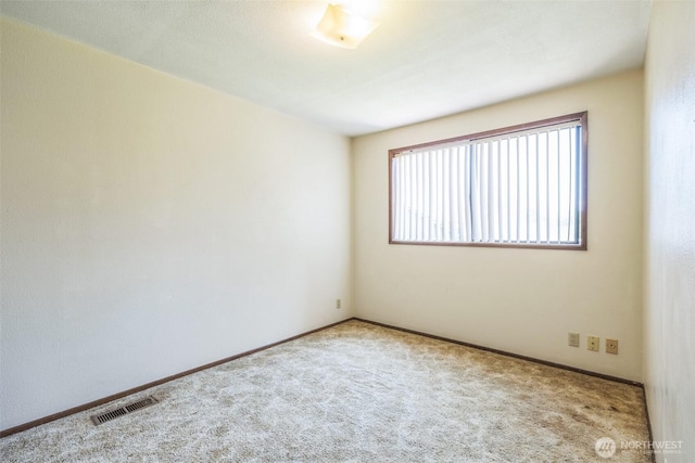 238 NE Damson Pl, College Place, WA 99324 - carpeted spare room featuring baseboards